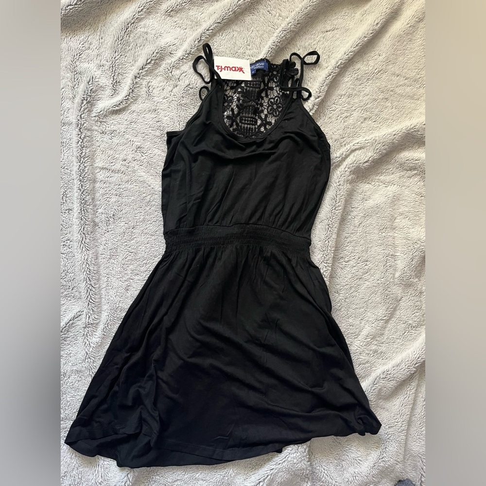 NWT mini black dress with crochet back detail size medium